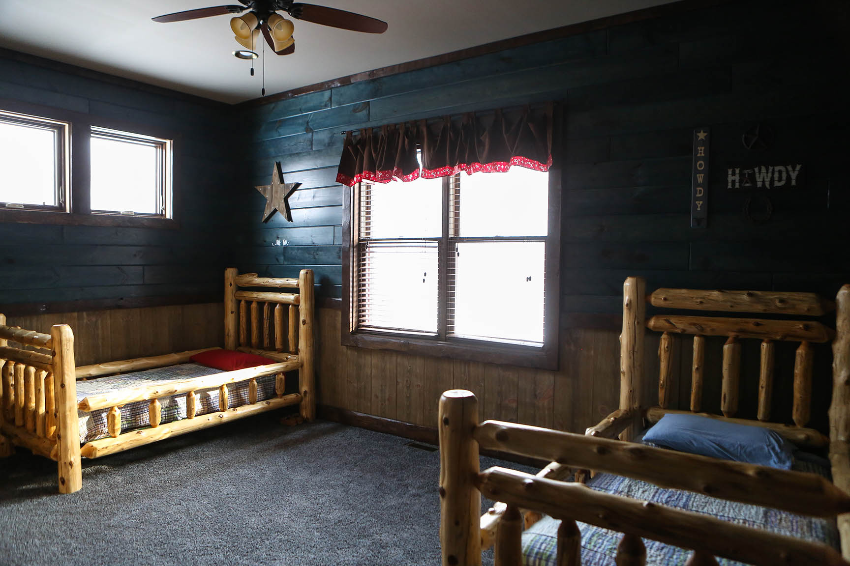 Log twin beds complement a log home.