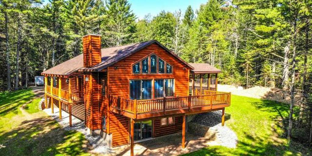 Log home built with 2x8 log siding with a butternut pre-finish stain.