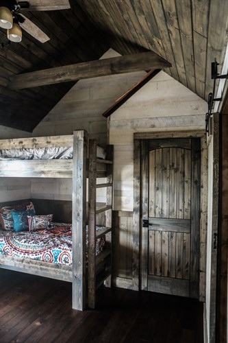 Lake house bunk beds with rough sawn shiplap.