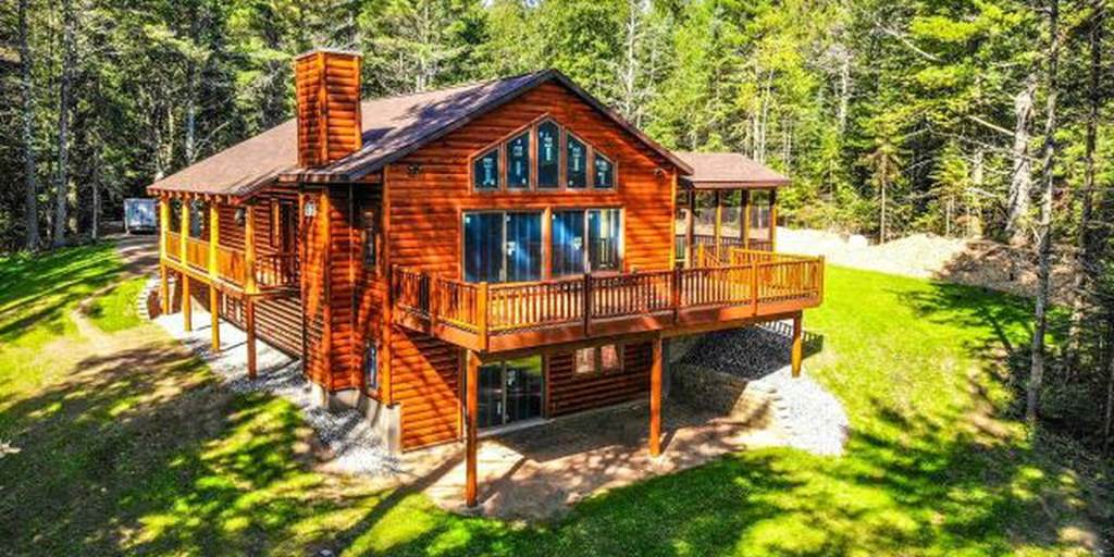 Log home built with 2x8 log siding with a butternut pre-finish stain.