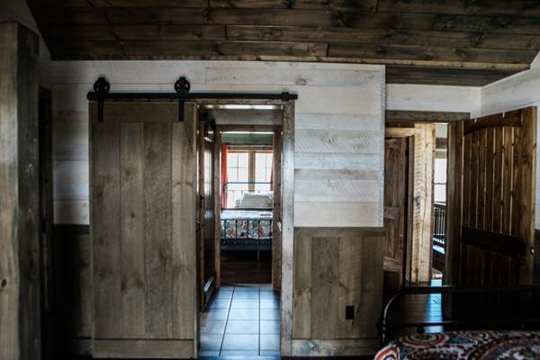 shiplap vs nickel gap, example of home with whitewashed shiplap installed from Northern Log Supply