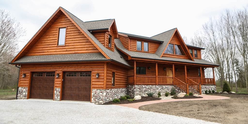 3x10 cedar hand-hewn log siding on exterior of home.