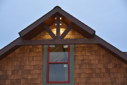 King post truss with cedar shake panels. Timber truss manufacturers