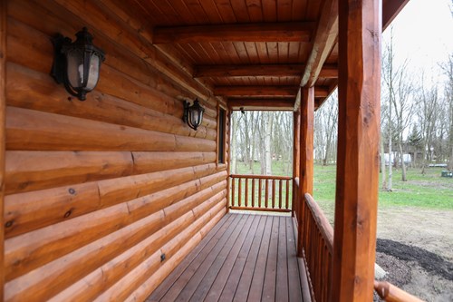 3x10 cedar hand hewn log siding.