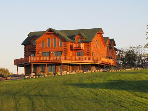 3x8 cedar log siding with butt and pass corners.