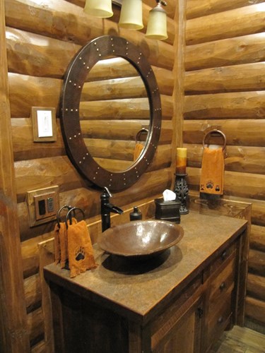 Bathroom with 2x8 pine log siding with mirror and sink vanity.