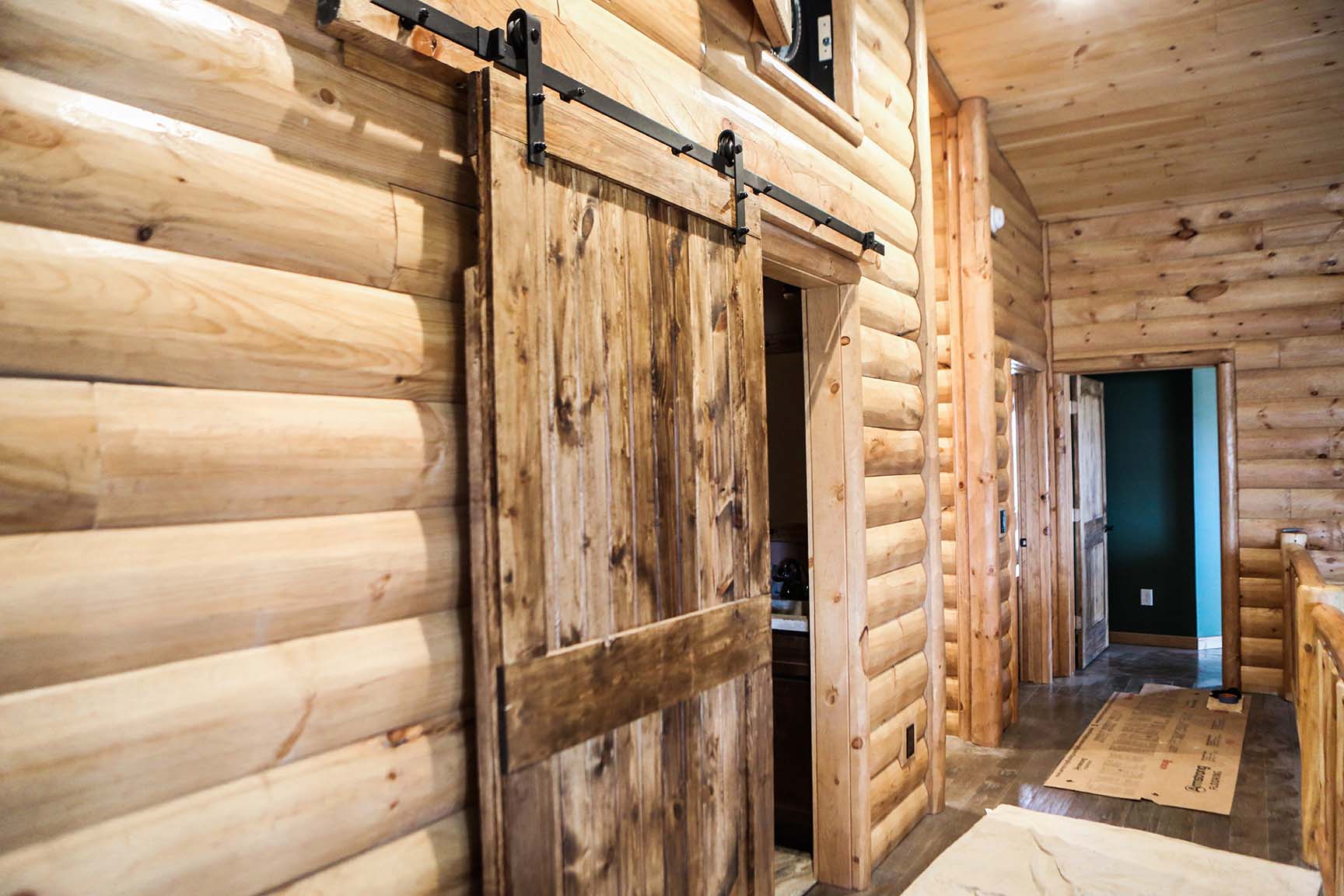 Knotty pine rustic burnt barn wood door. With custom barn door hardware, size 4-0.