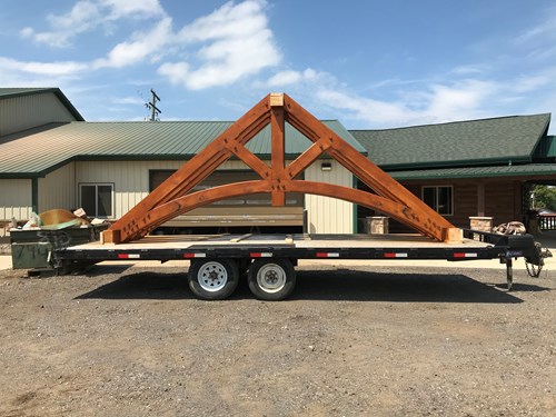 King post truss with curved tie beam. Timber truss manufacturers