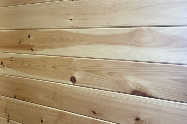 Pre-finished tongue and groove pine paneling.
