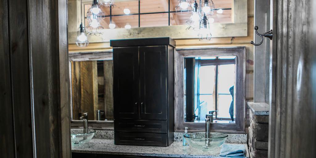 Lake house bathroom countertop with barn wood siding.