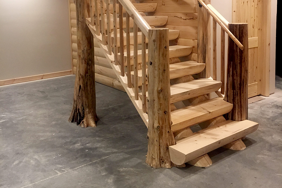 milled-half-log-staircase_flare-bottom-trees-min log home supplies