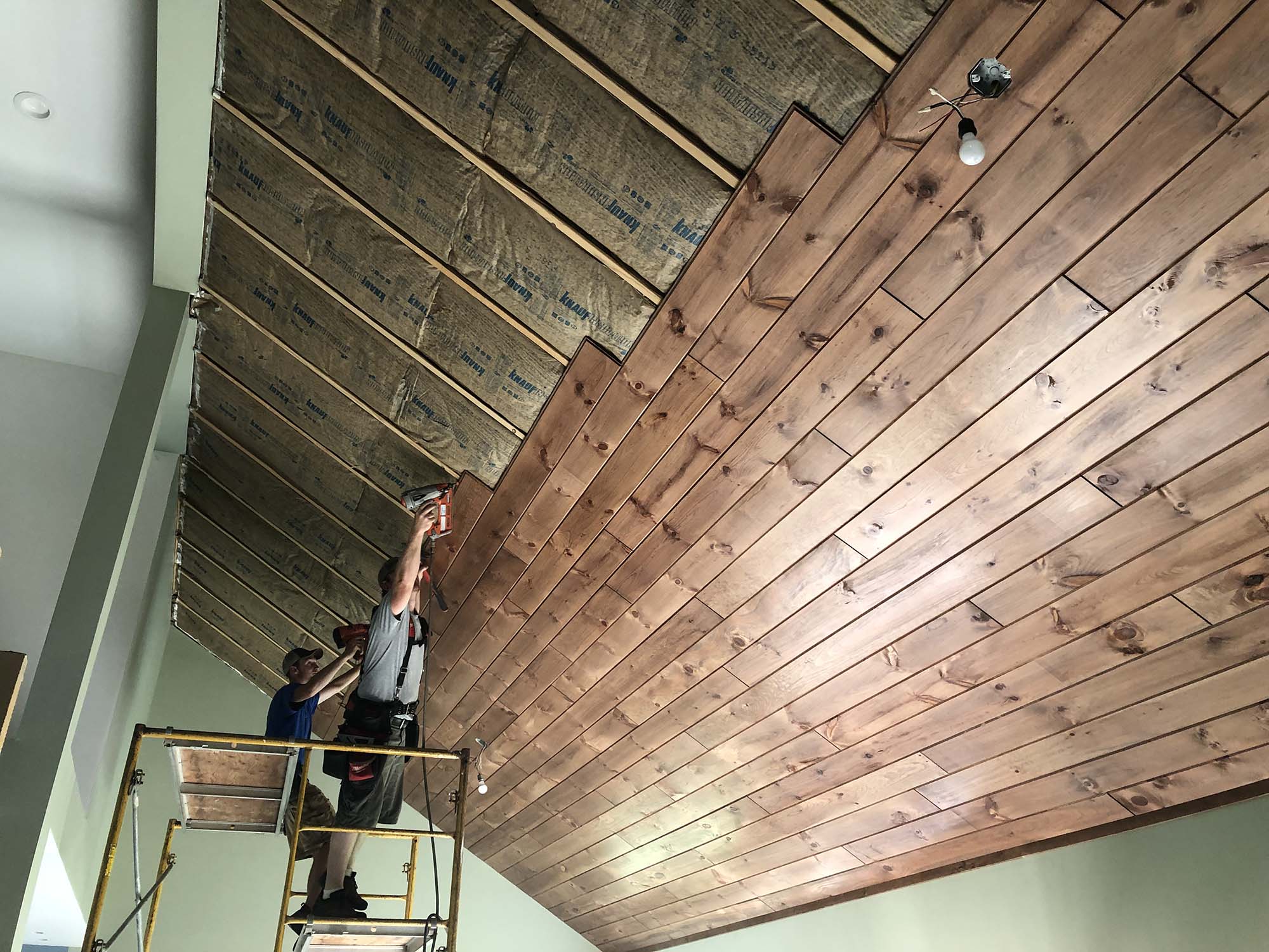 steve-bennick_1x8-pine-paneling_gunstock_1x4-pine-trim_installation-2-1 log home supplies