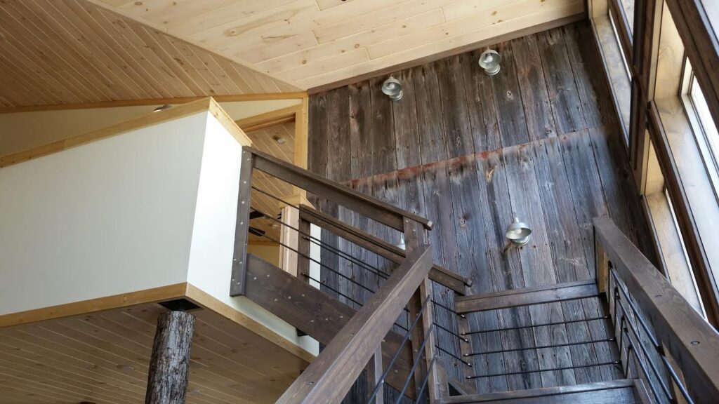 Wood siding stain trends are shifting away from cool grays and toward warmer, more natural finishes. Explore the top stain colors for 2026 and 2027, including warm earth browns, taupe, black oak, golden oak, and barely-there natural stains for log homes, cabins, and wood siding exteriors.